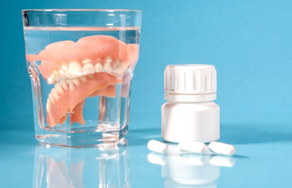 What should i soak my dentures in at night